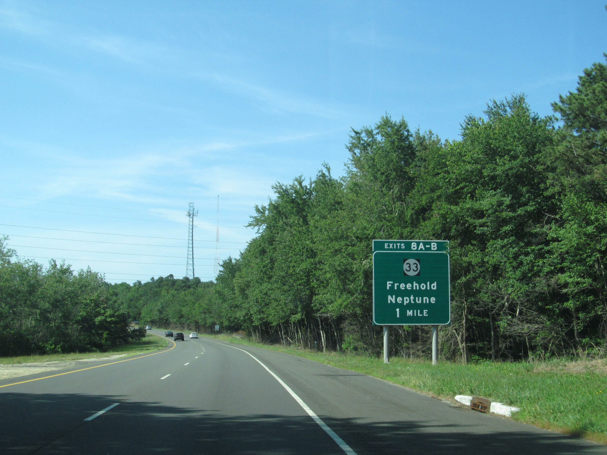 Road sign showing exit for Freehold and Neptune.