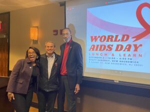 A photo of Garden State Equality team members Aleyah Lopez and John Juska, as well as J Gavin of the Hyacinth AIDS Foundation, during the 2023 World AIDS Day Summit.