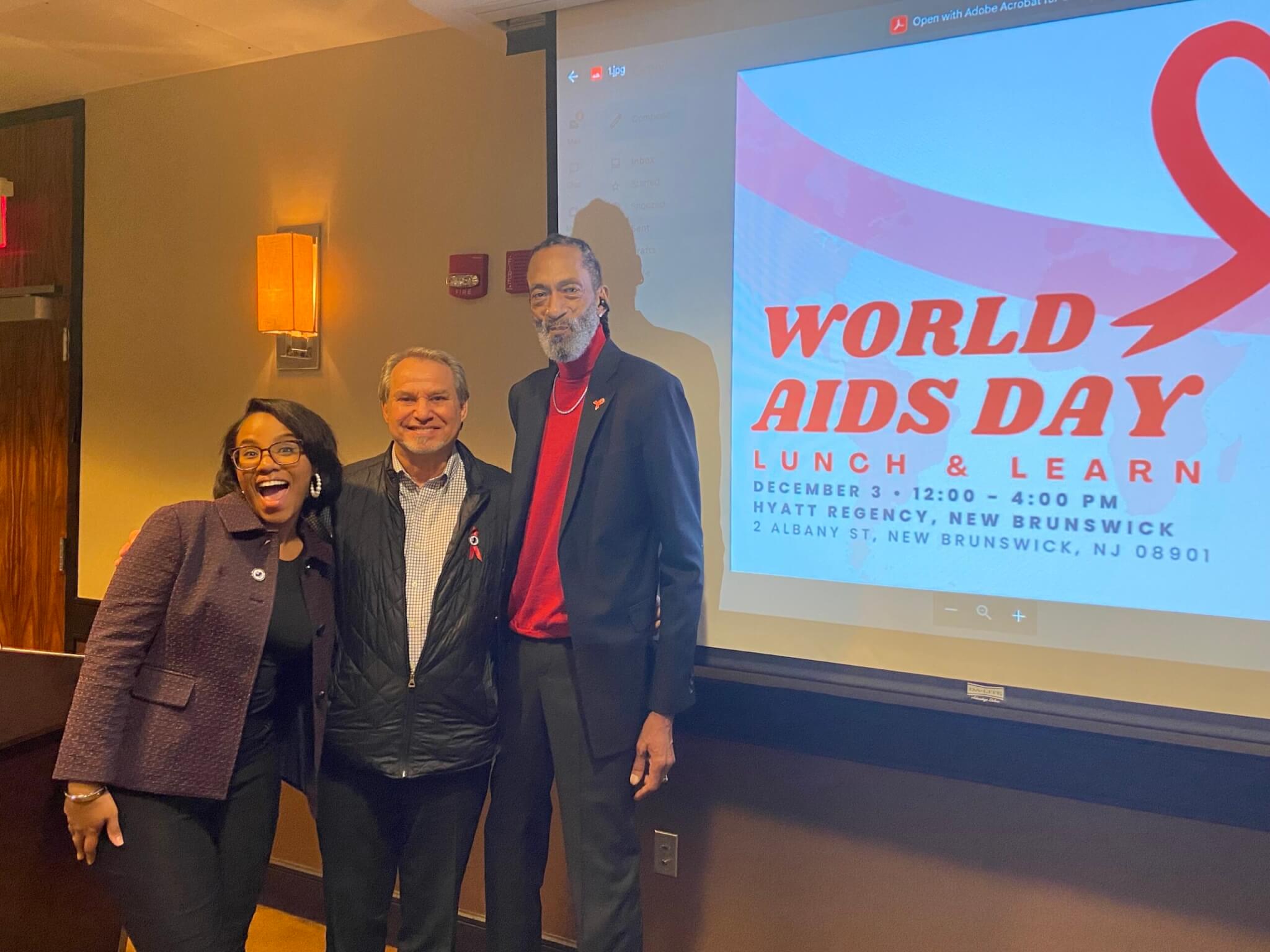 A photo of Garden State Equality team members Aleyah Lopez and John Juska, as well as J Gavin of the Hyacinth AIDS Foundation, during the 2023 World AIDS Day Summit.